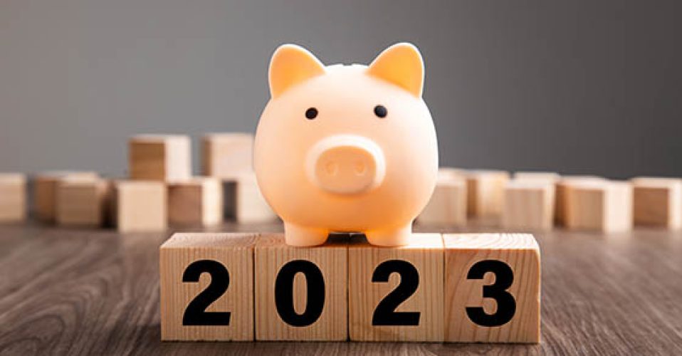 Budget Plan 2023. Piggy Bank on top of wooden block